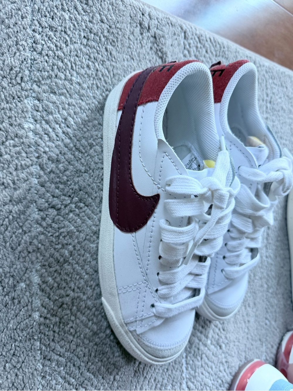 Nike White Low-Top Sneakers with Burgundy Swoosh
